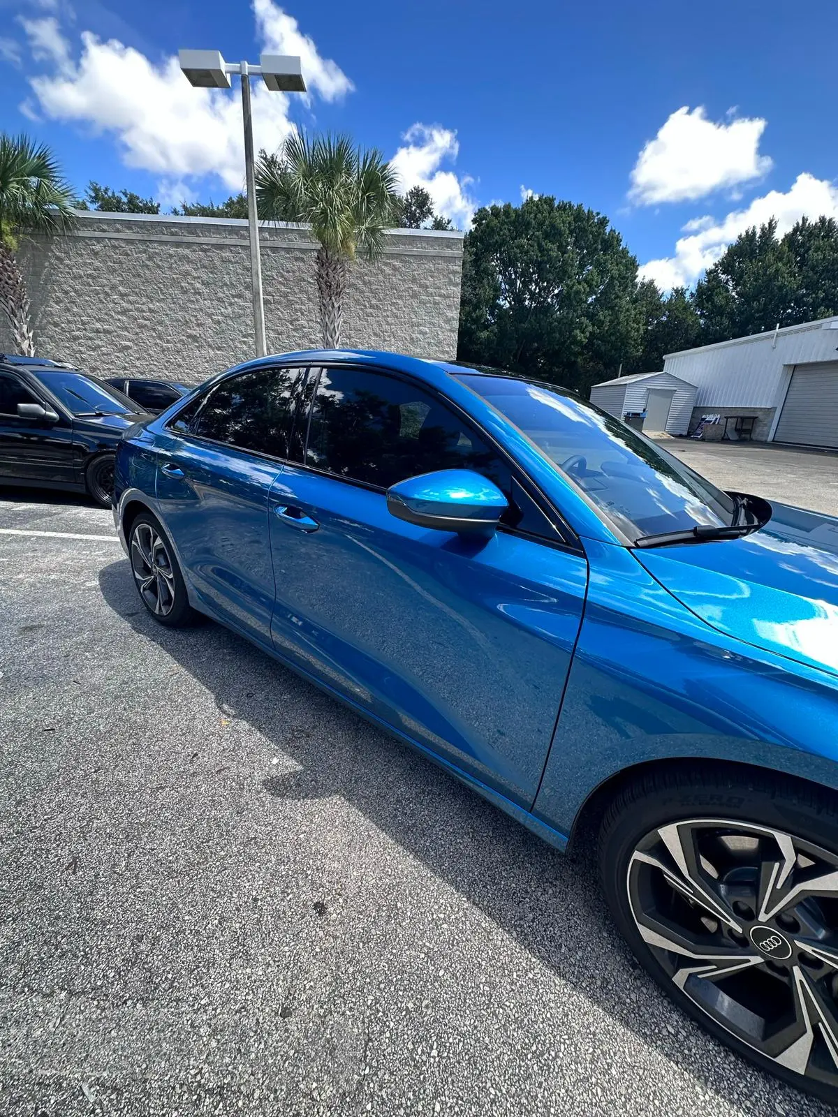 Metallic blue SUV with professional window tinting