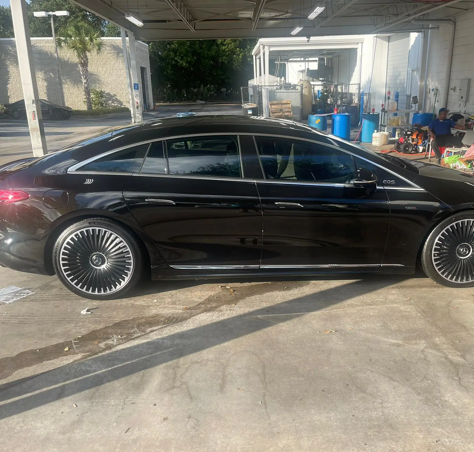 Black Mercedes-Benz EQS luxury sedan with premium window tinting